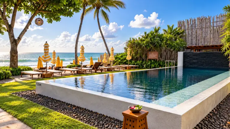 Pool at Buri Rasa Village Samui facing Chaweng Beach, with yellow parasols