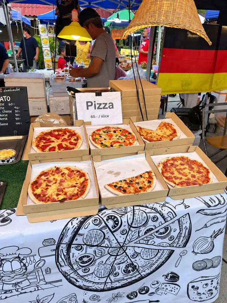 A pizza and lasagne stall at the Chaloklum Sunday market