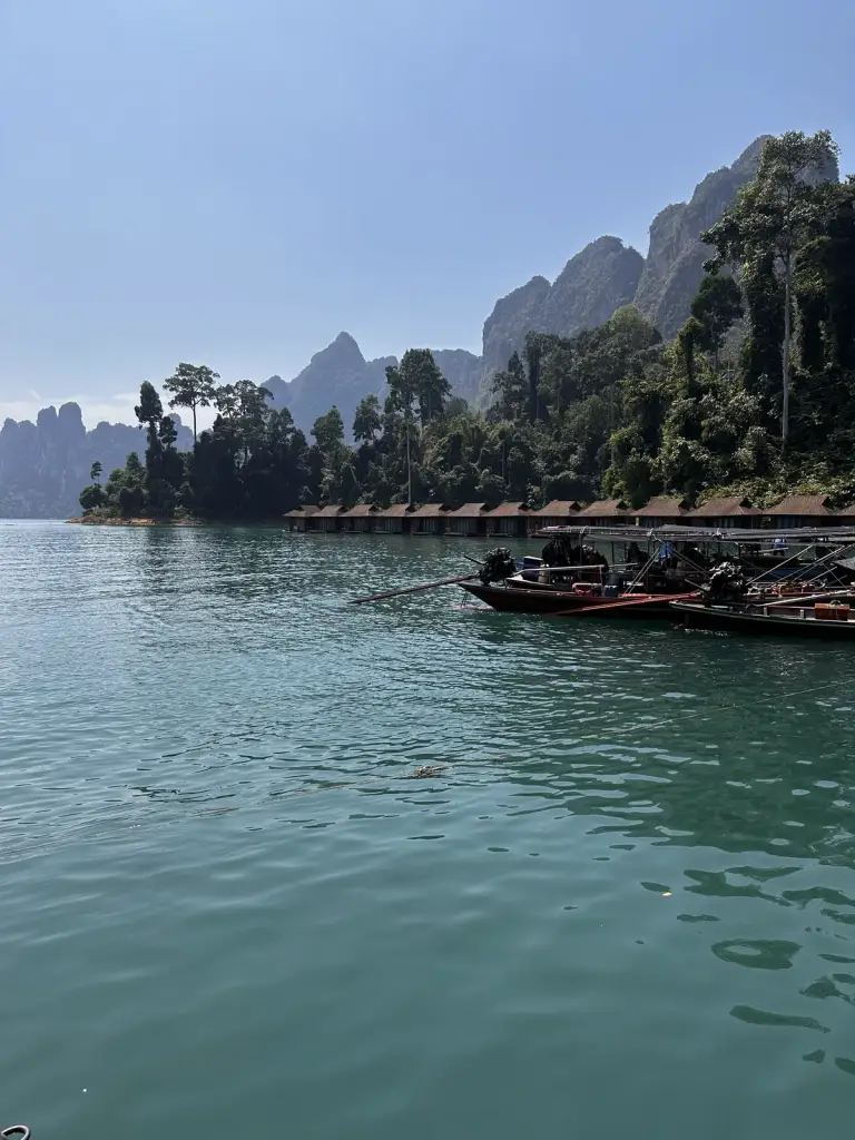 Longtail boats next to the floating bungalow camp on Cheow Lan Lake