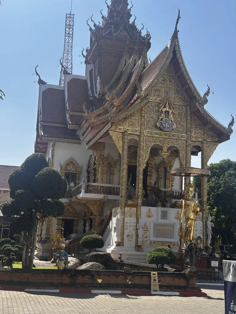 A gold-decorated temple facade in Chiang Mai