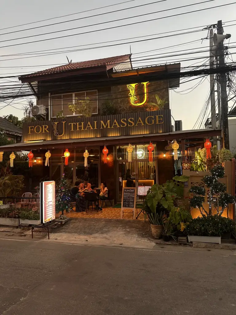 The lit-up front of a massage shop in Chiang Mai