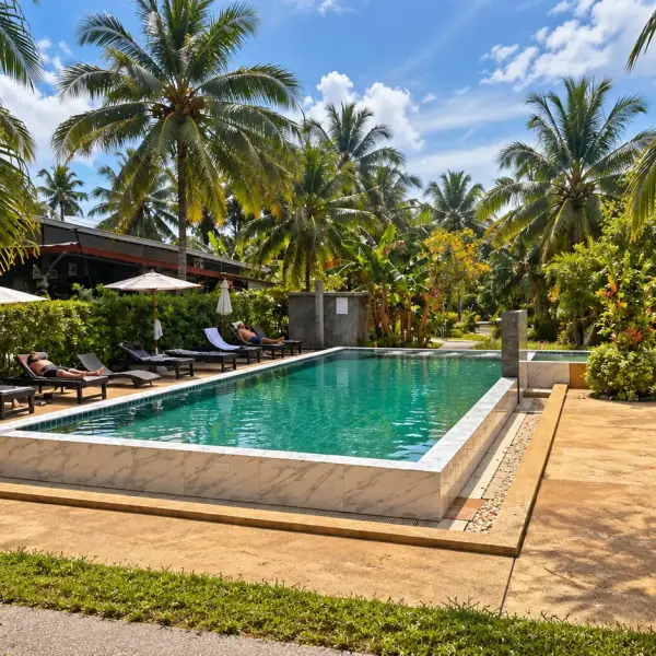 Pool at Grandfather Khaolak Resort among coconut palms and the tropical garden, Khao Lak