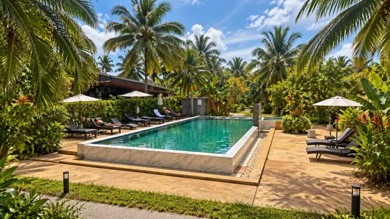 Pool at Grandfather Khaolak Resort among coconut palms and the tropical garden, Khao Lak