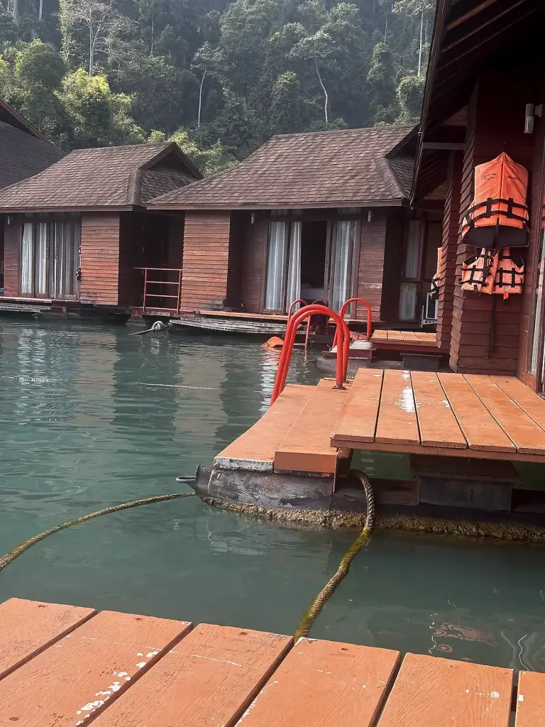 Deck of a floating bungalow with a ladder into the water, Cheow Lan Lake