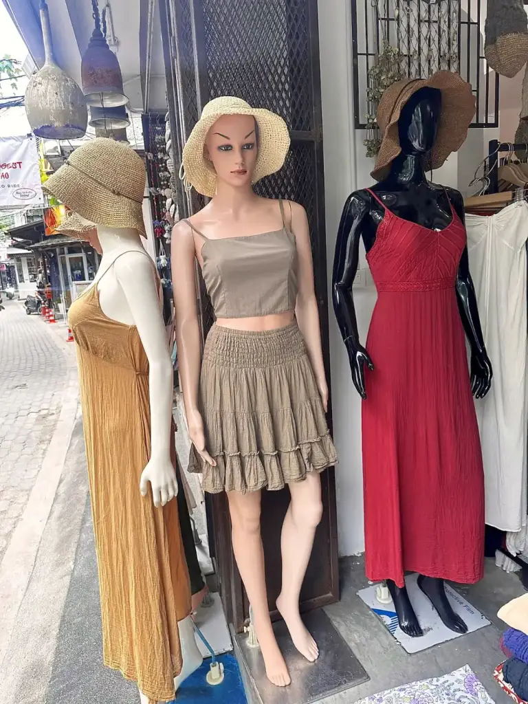 Dresses and skirts on mannequins in a clothes shop in Sairee, Koh Tao