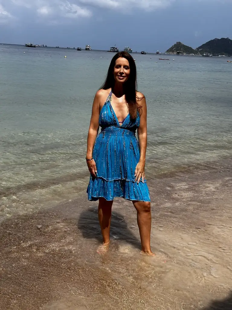 Michelle Loren in the blue dress in the water at Sairee Beach