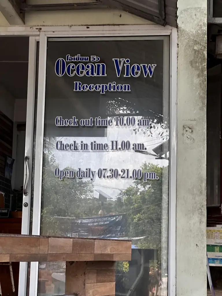 The reception at Ocean View Resort on Koh Tao, with check-in times