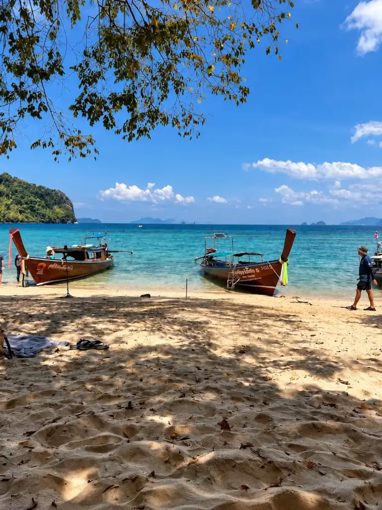 Longtail boats on the beach at Koh Pak Bia