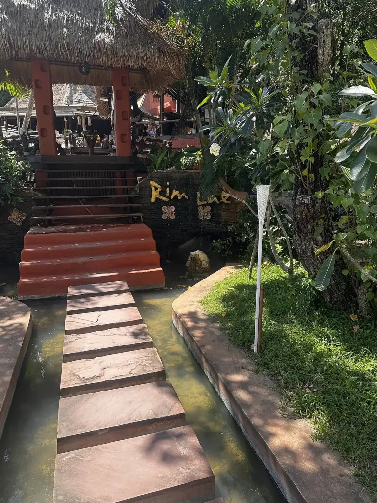 The entrance steps to Rim Lae Restaurant among the greenery