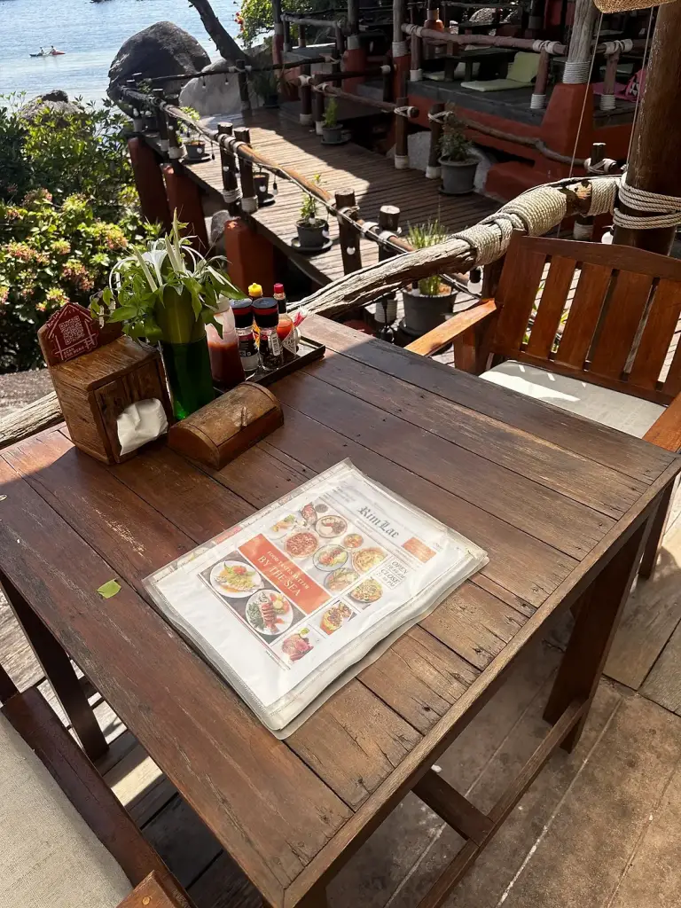 The Rim Lae menu on a wooden table