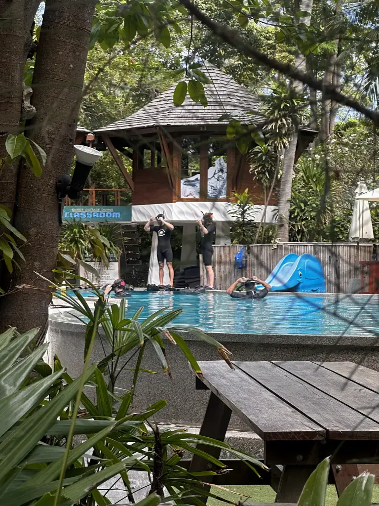 The pool at Sairee Cottage with the dive classroom sign, Koh Tao