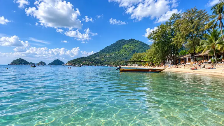 Sairee Beach on Koh Tao - turquoise water, a longtail boat and the green hill