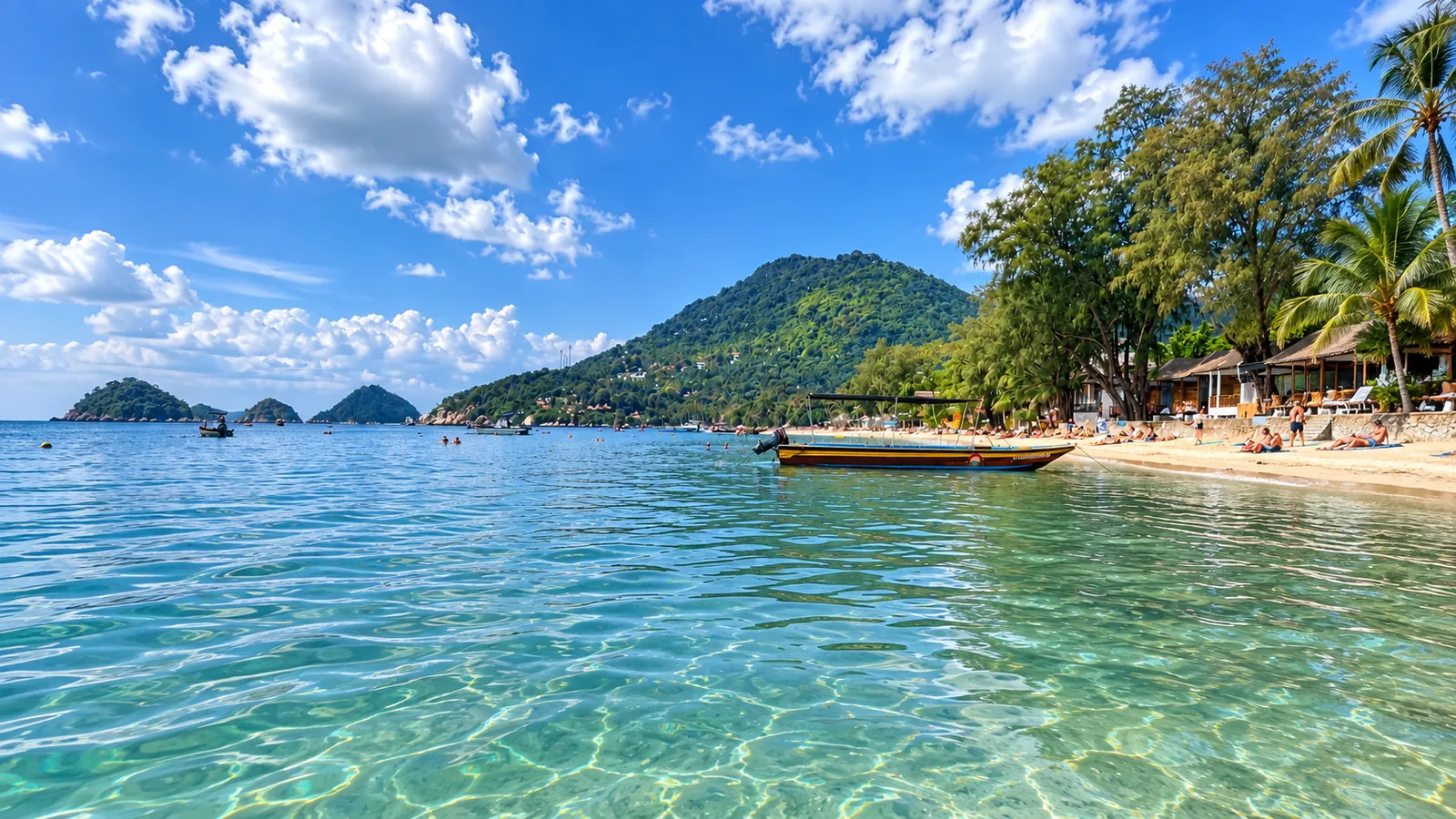 Sairee Beach on Koh Tao - turquoise water, a longtail boat and the green hill