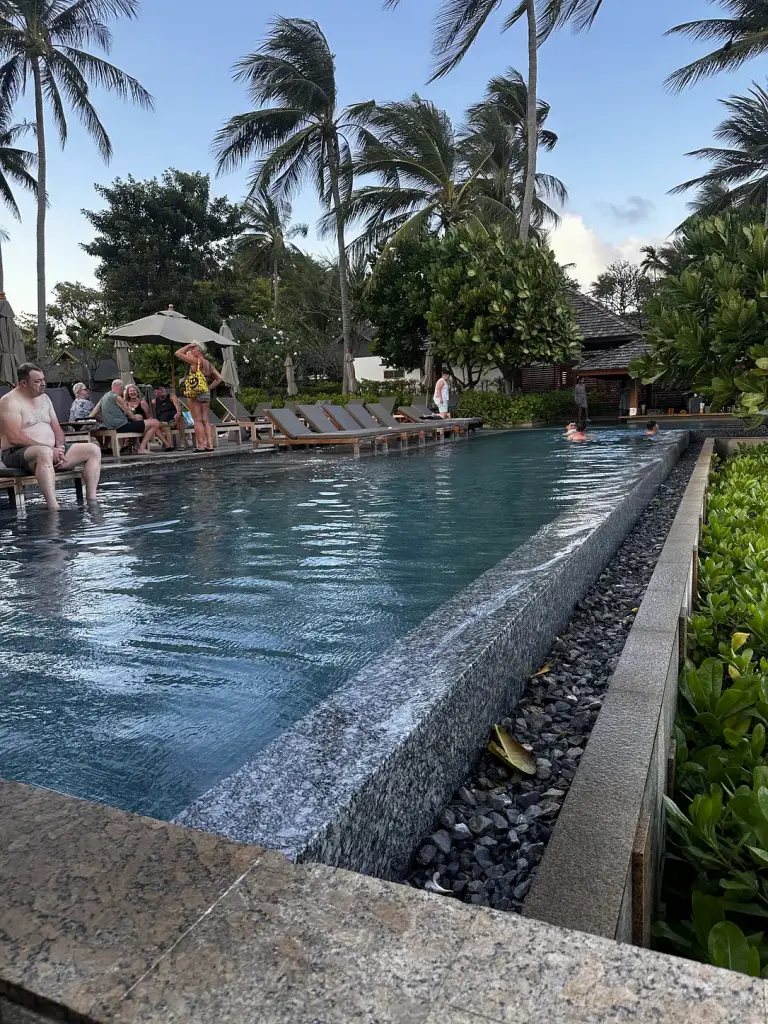 The long pool among the trees at Banana Fan Sea Resort