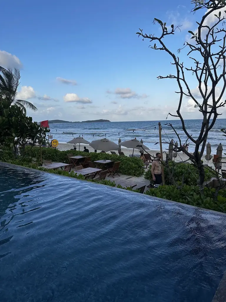 The pool at Banana Fan Sea with the sea behind it