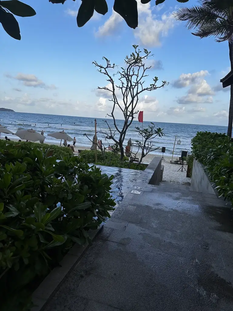 A green path leading down from the hotel to the beach at Banana Fan Sea