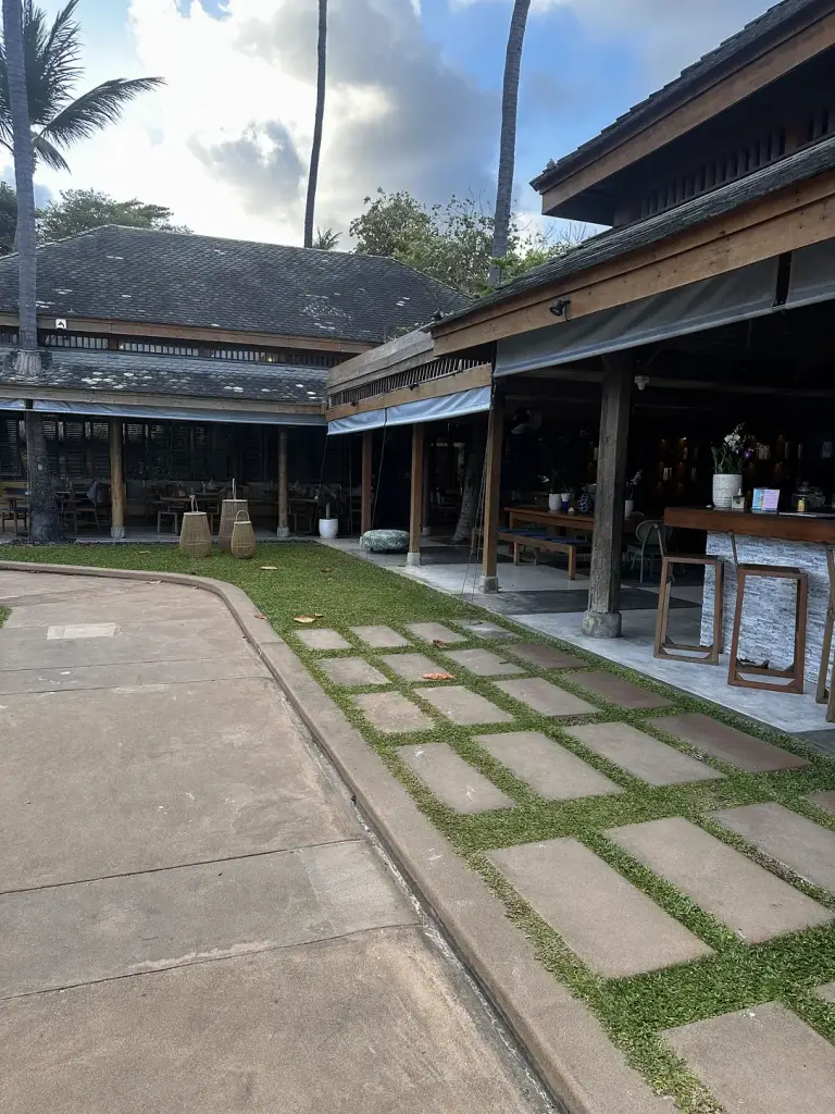 The path between the lawn and the buildings at Buri Rasa Village