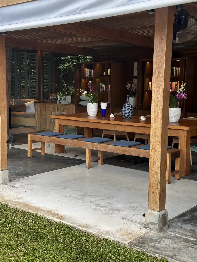 A wooden seating corner in a pavilion at Buri Rasa