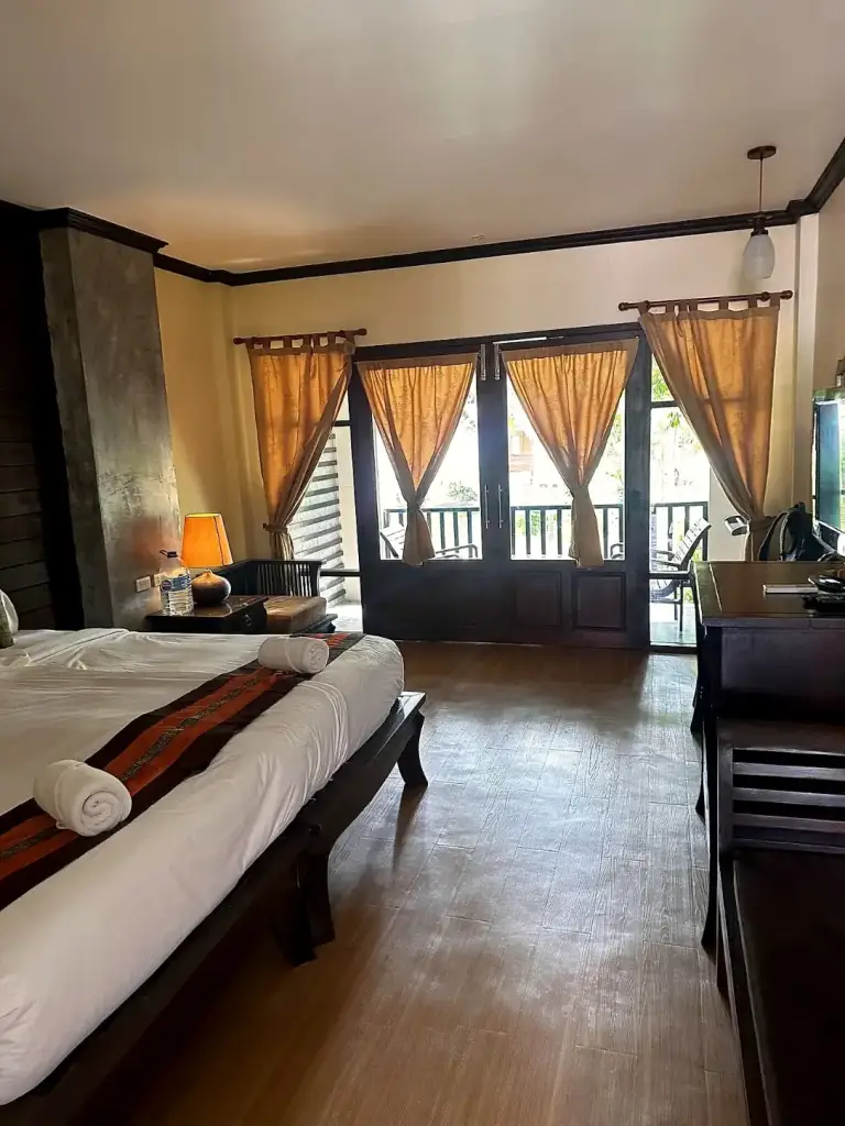 Room at Seashell Resort, double bed and doors to the balcony