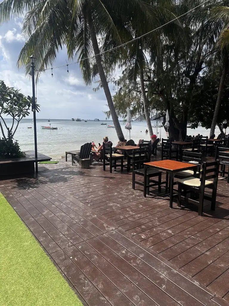 The deck of the beachfront restaurant and bar at Seashell Resort, Sairee Beach