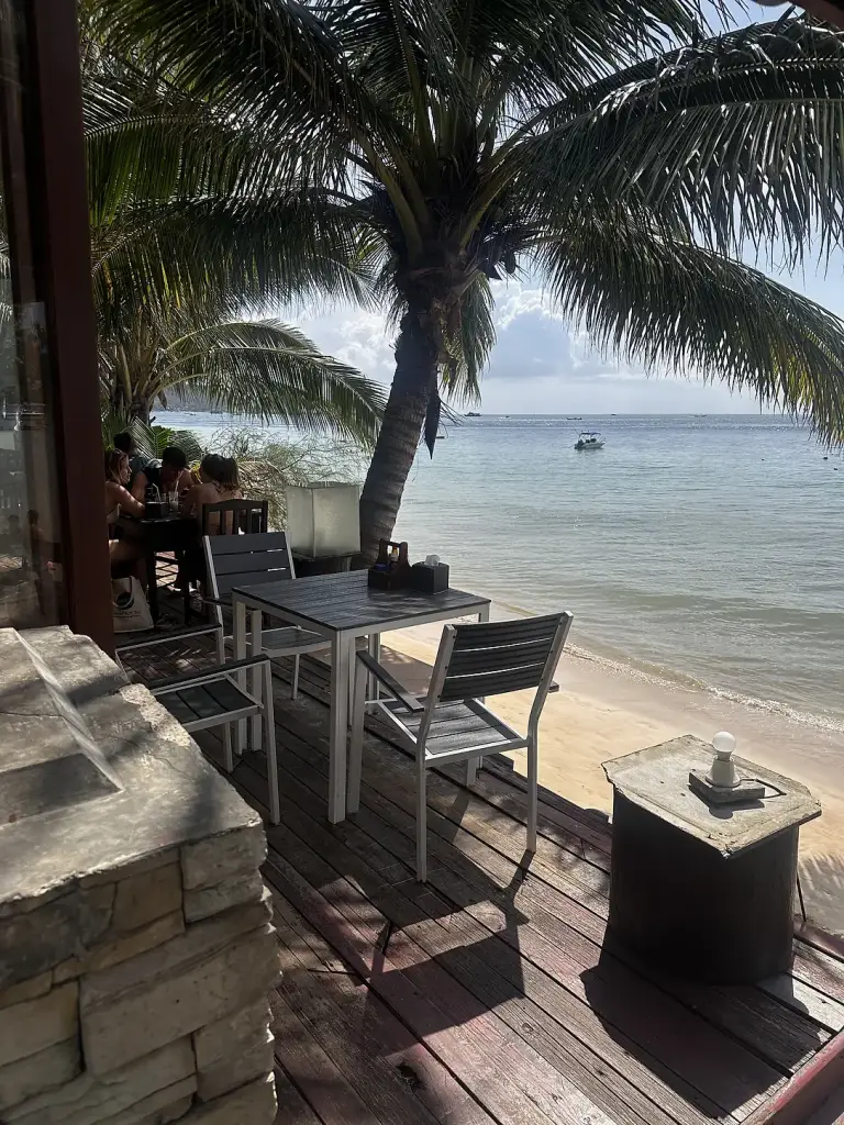 Tables facing the sea at the Seashell Resort beach bar