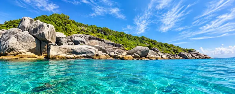 Huge granite boulders and clear turquoise water in the Similan Islands