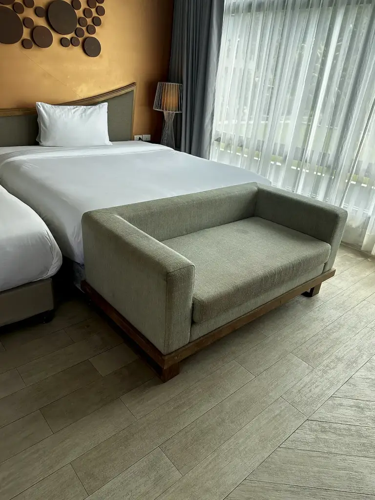 The bed and the sofa in the room at The Tarna Align Resort