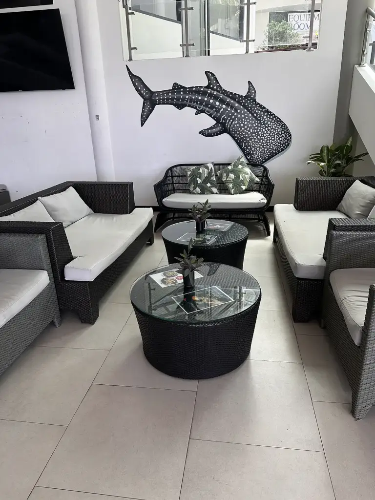 A seating area with a whale shark painting at The Tarna Align Resort