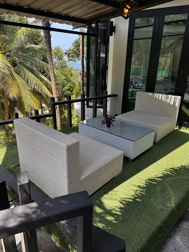 A seating terrace among the trees at The Tarna Align Resort