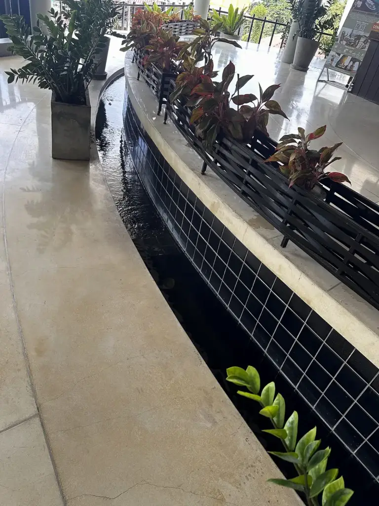 A water channel along the walkway at The Tarna Align Resort